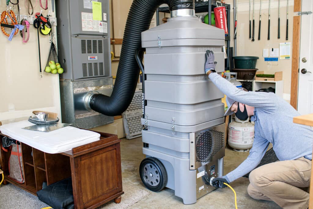 air duct cleaners connecting vacuum to furnace in Phoenix home.